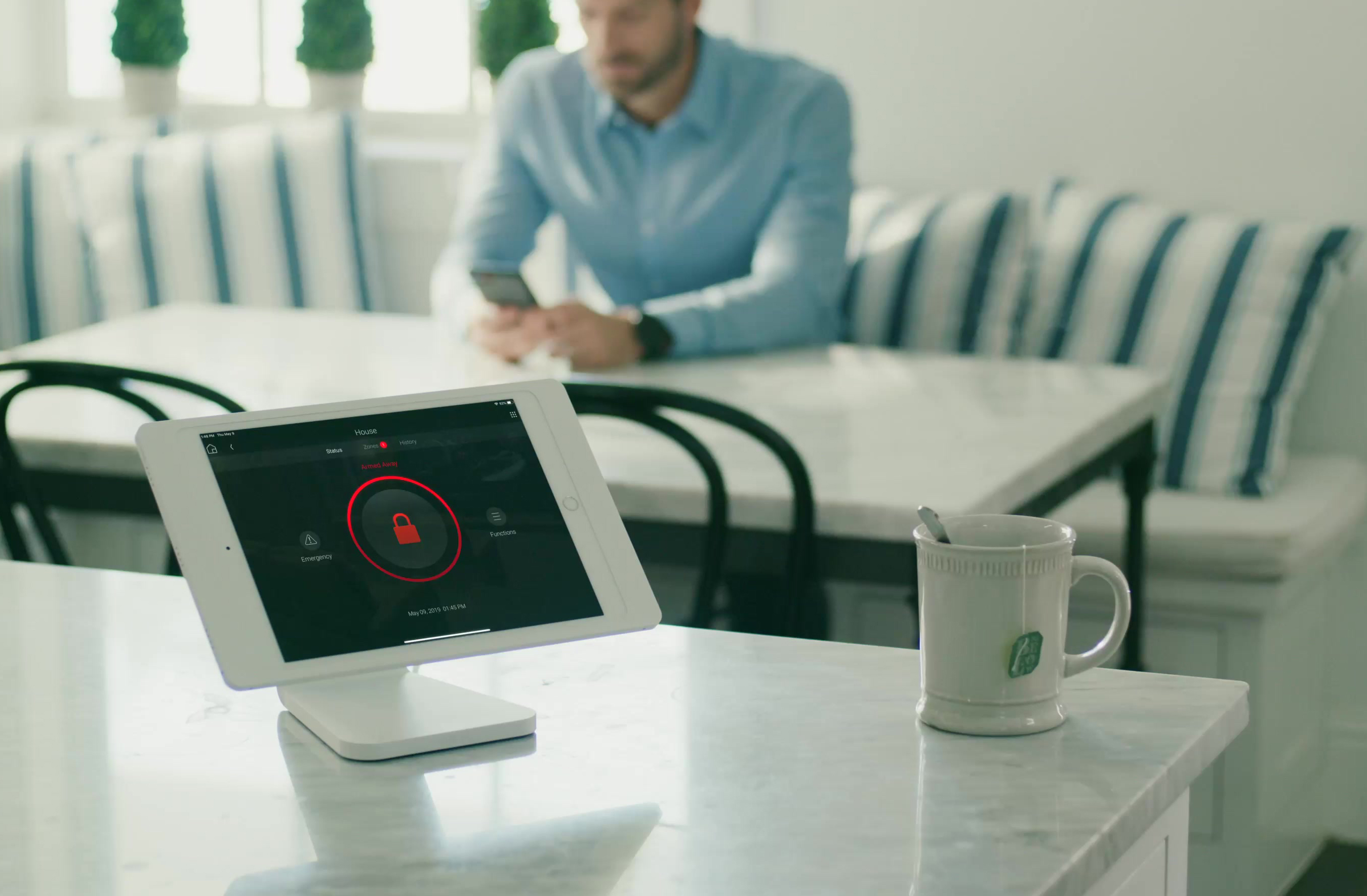Control4 touch panel on a kitchen table