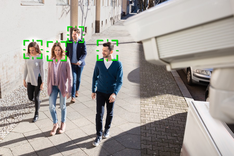 Video surveillance footage that recognizes a group of four people.